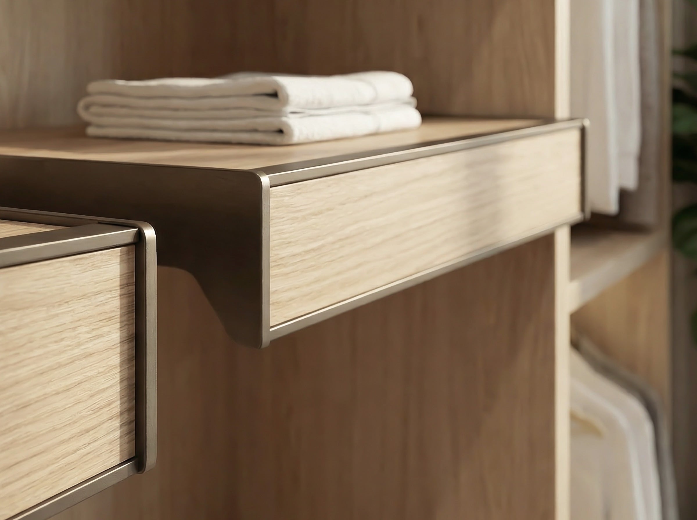 Wooden shelf with folded white towels inside a cabinet