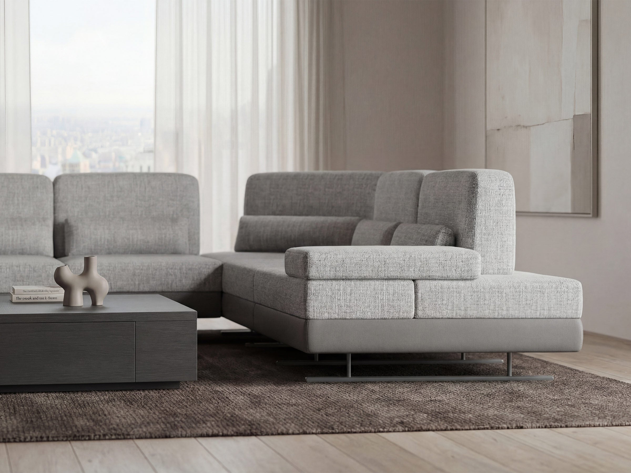 Gray sectional sofa in a living room setting with a neutral color palette.