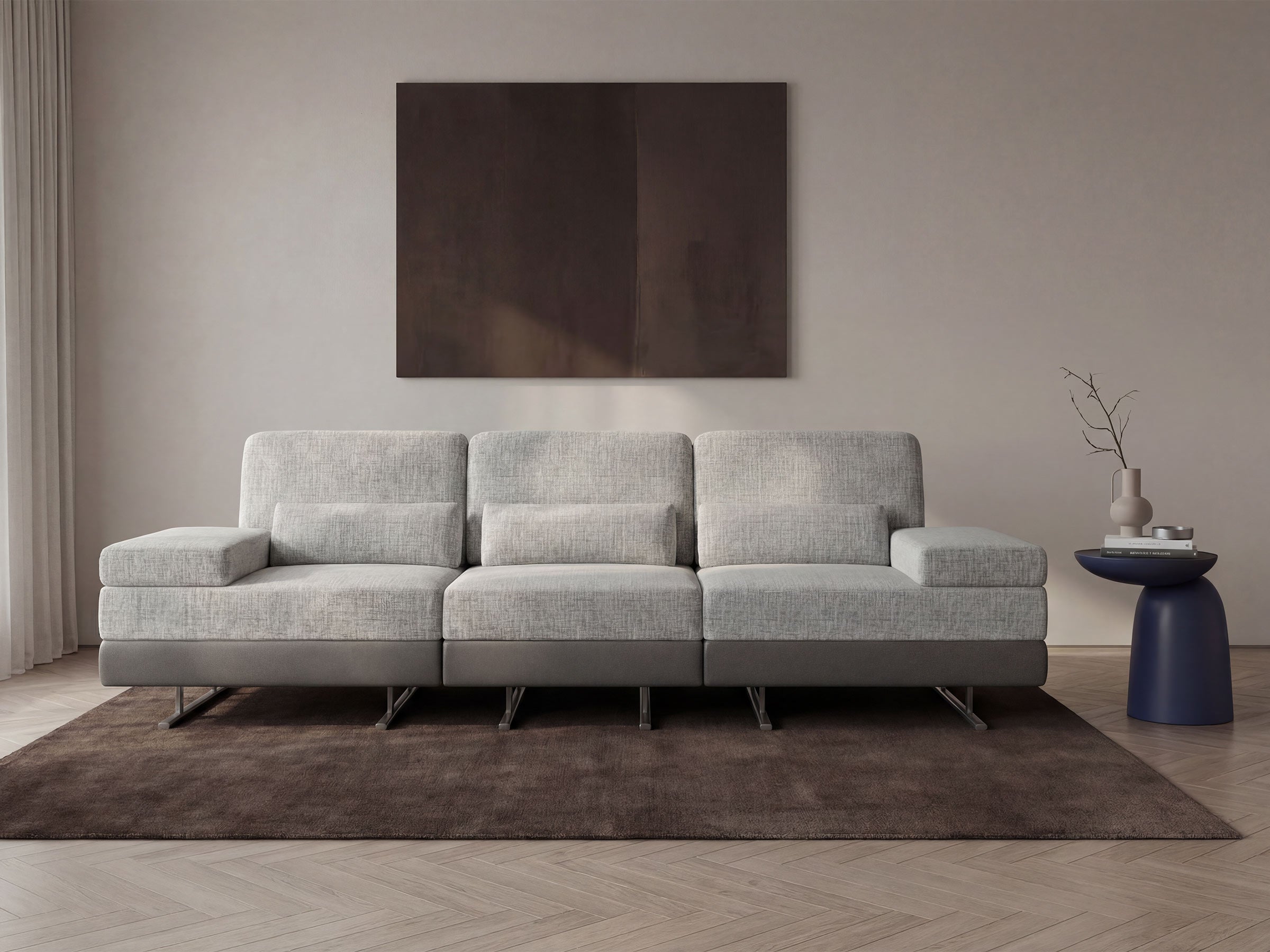Gray sectional sofa in a modern living room with a abstract painting on the wall.