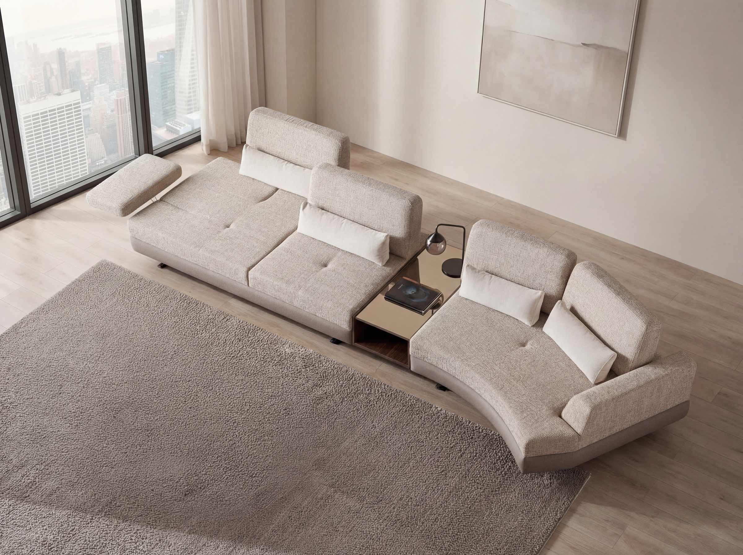 Modern beige sectional sofa in a living room with large windows and cityscape view.