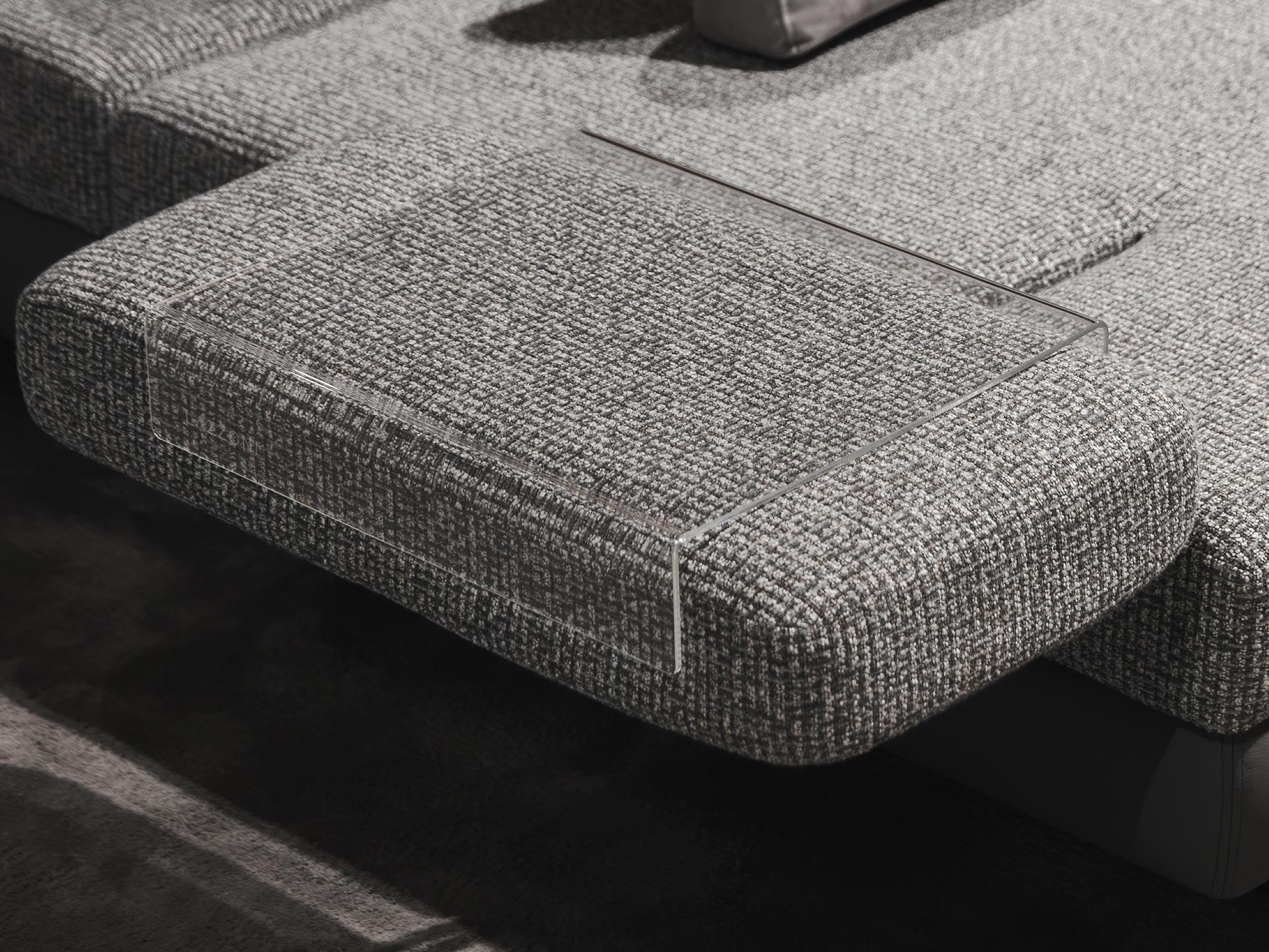 Gray textured Mony sofa with a focus on the cushions