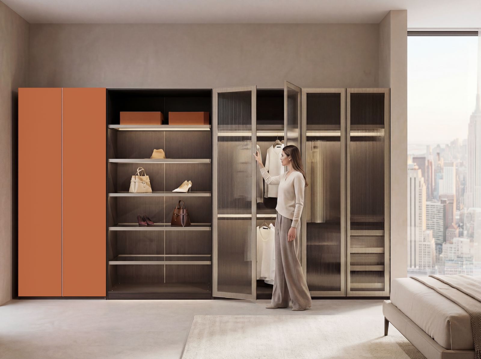 A LAZZONI wardrobe system pairing a solid orange cabinet with open wood shelving for folded clothes, bags, and shoes, alongside fluted-glass doors concealing a hanging section.
