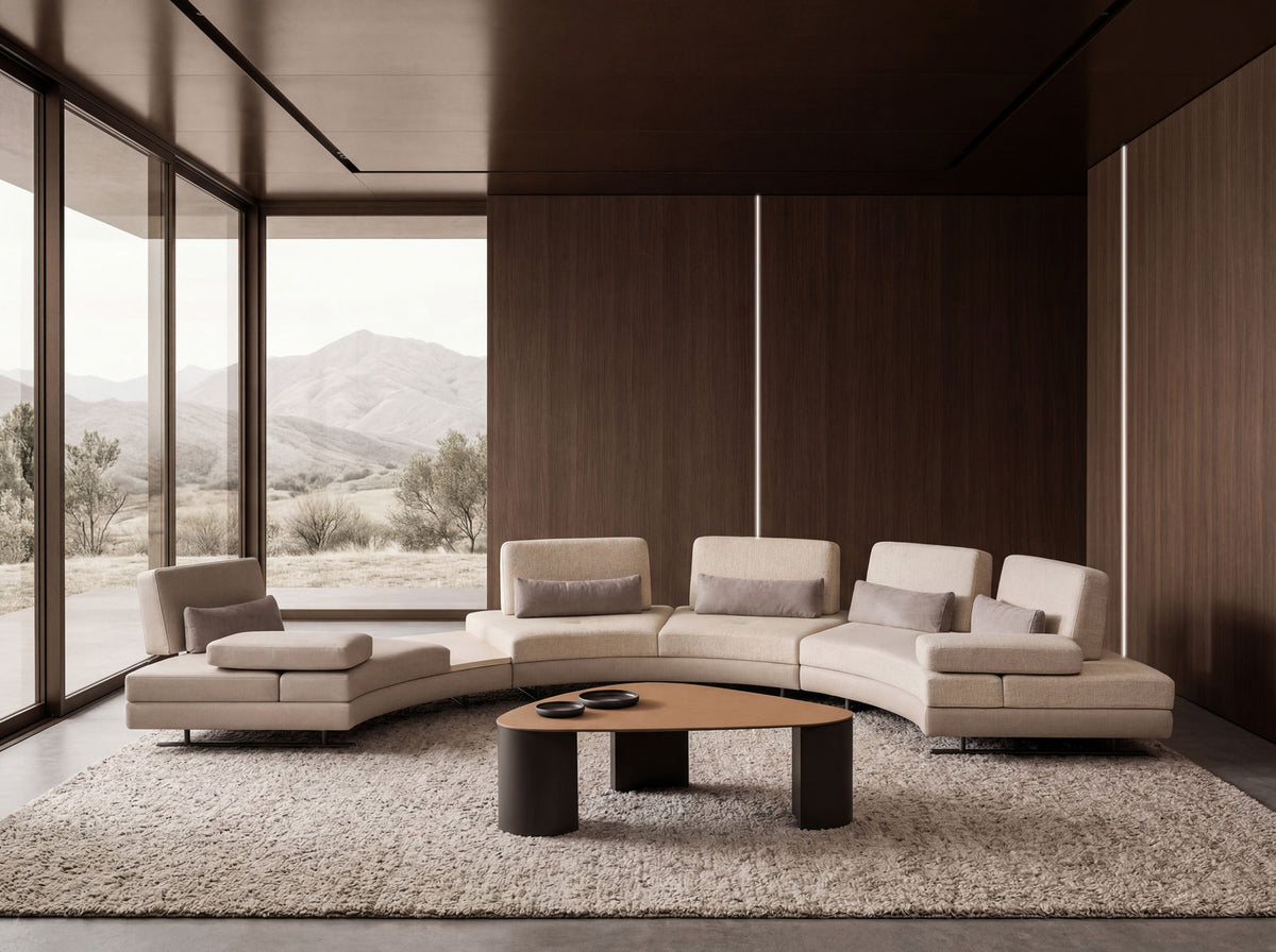 A cream modular sofa curving across a wood-panelled room, its separate seat units, corner module and end chaise each reading as a distinct piece