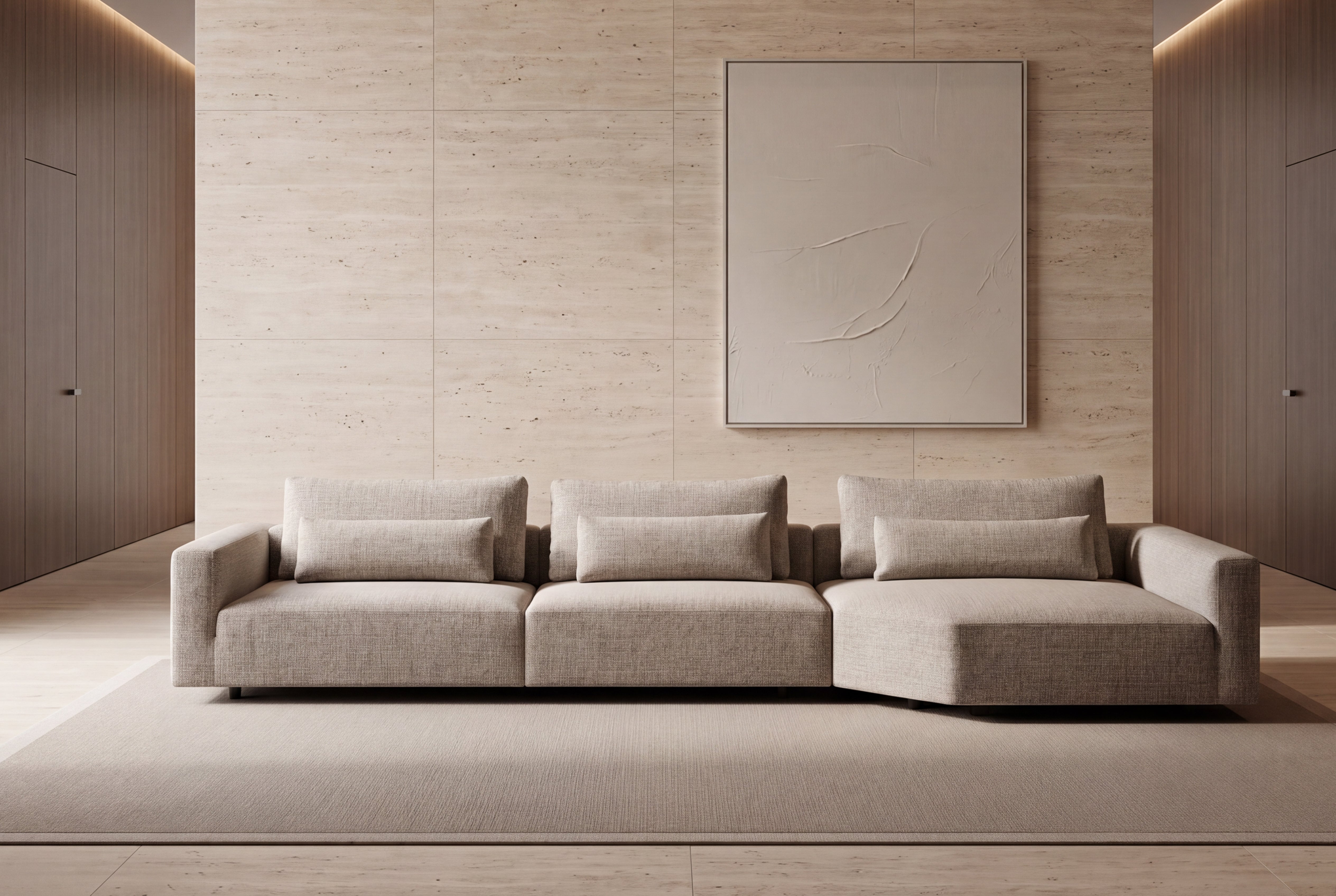 Merlin modern three-seat sectional sofa in a light beige fabric, styled in a minimalist, warm-toned living room with a matching rug, textured wall panels, and a large abstract painting.