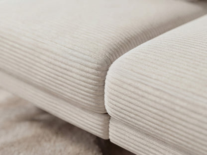 Close-up of beige corduroy fabric with a soft texture