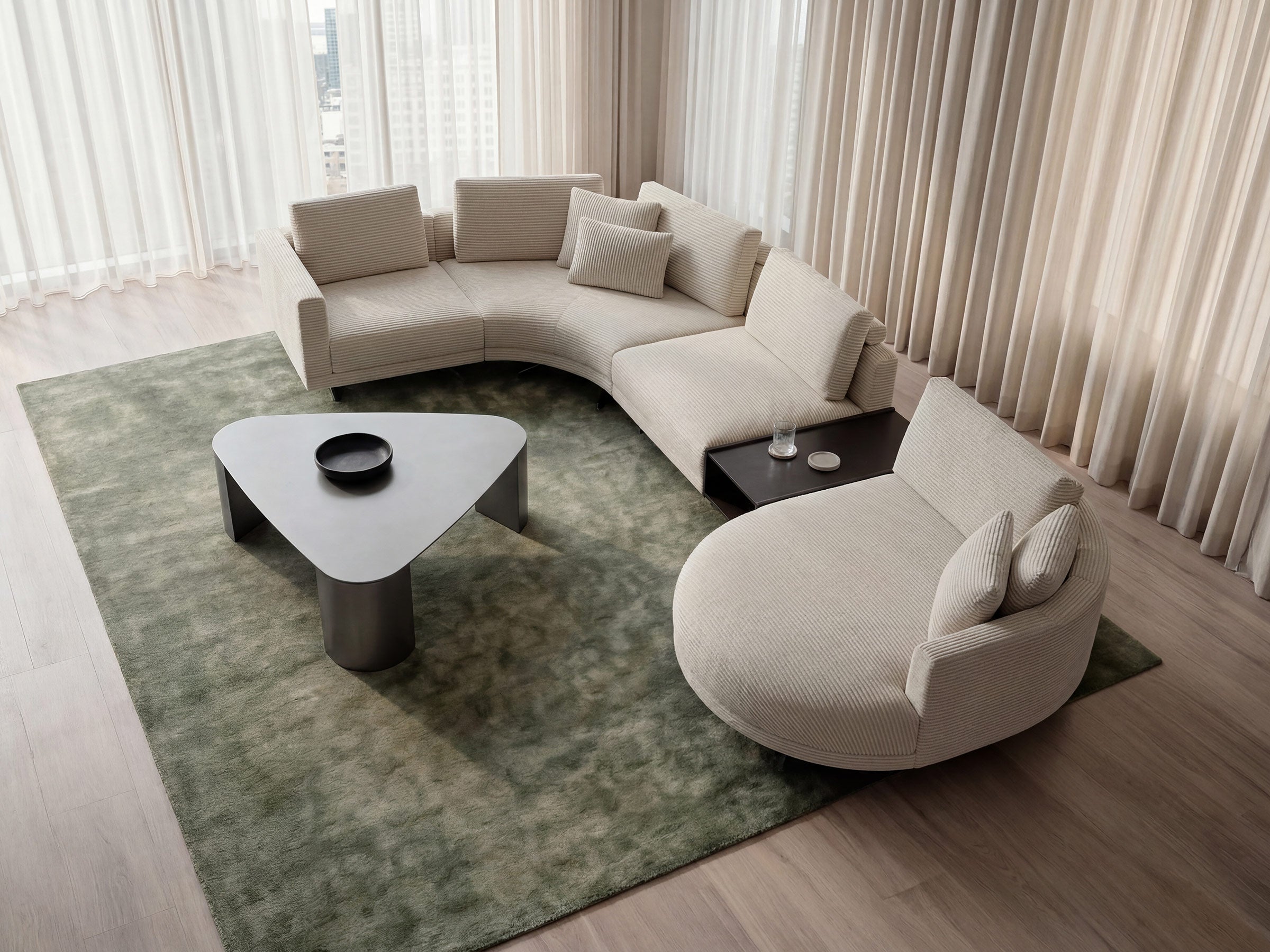 Modern living room with a beige sectional sofa, coffee table, and side table.