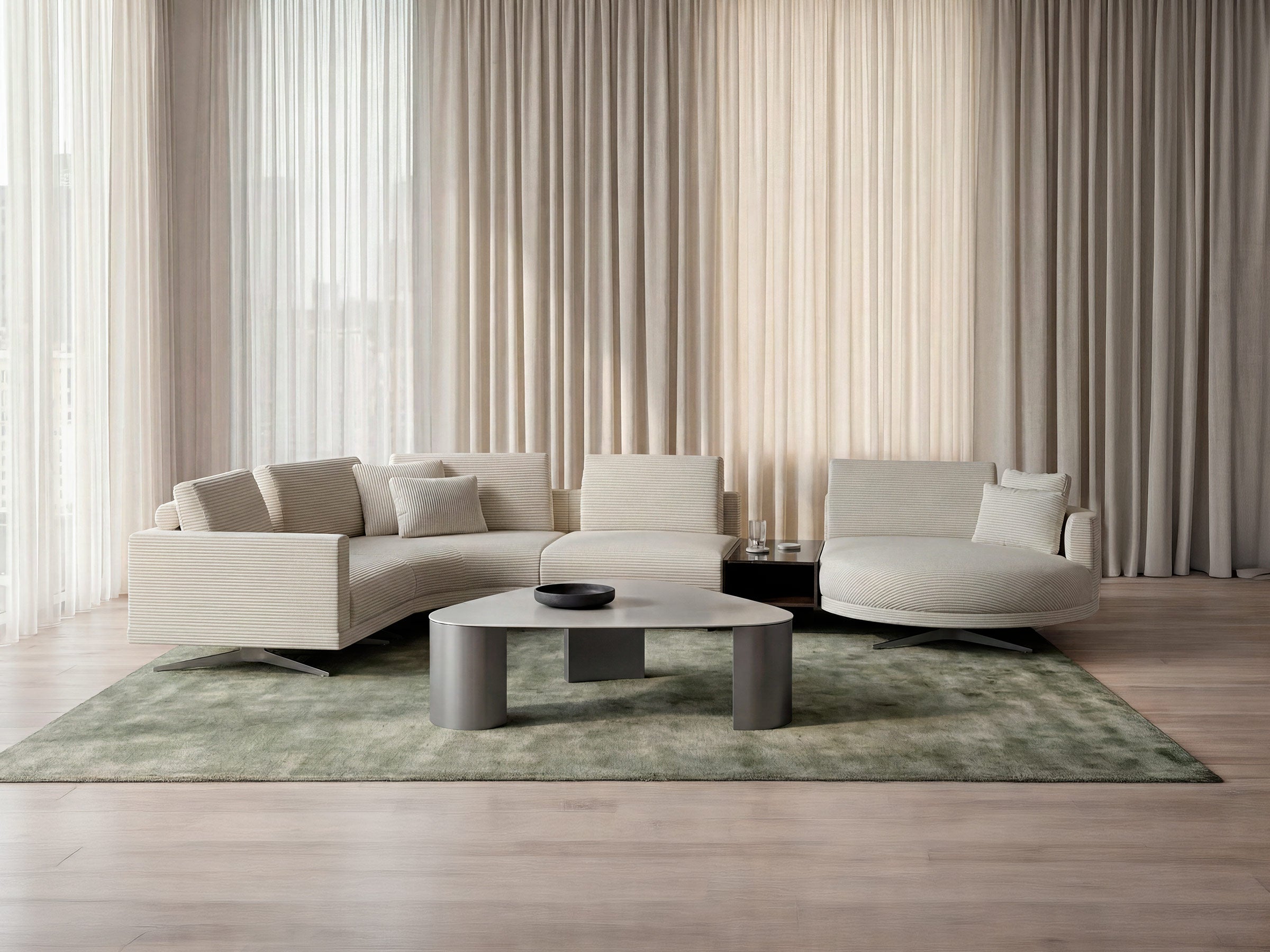 Modern living room with a beige sectional sofa, coffee table, and curtains.