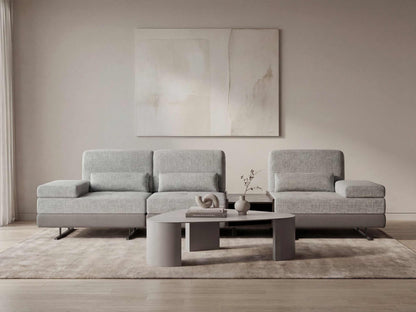Modern living room with a gray sectional sofa and coffee table.