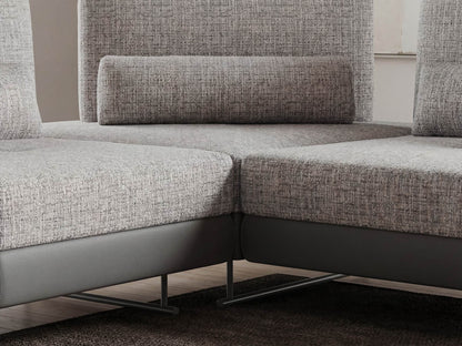 Gray textured sectional sofa with a modern design.