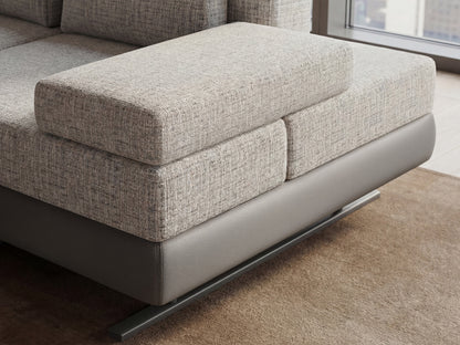 Gray textured sectional sofa in a living room setting.