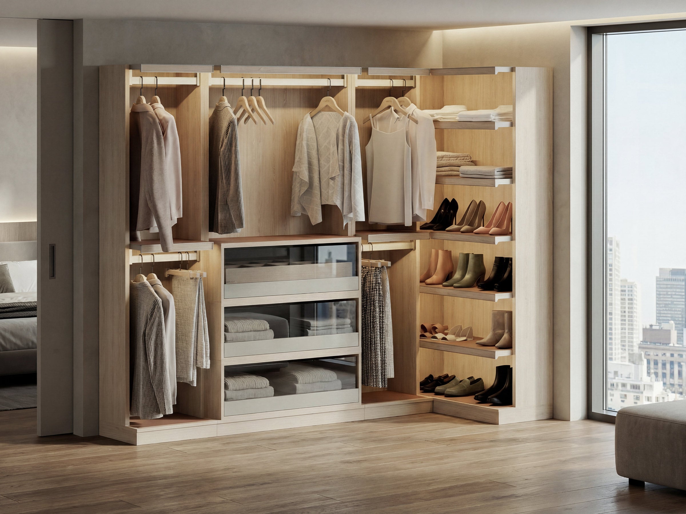 Modern walk-in closet with clothes, shoes, and shelves in a well-lit room.