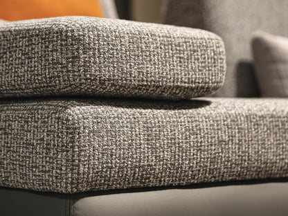 Close-up of textured gray fabric on a sofa