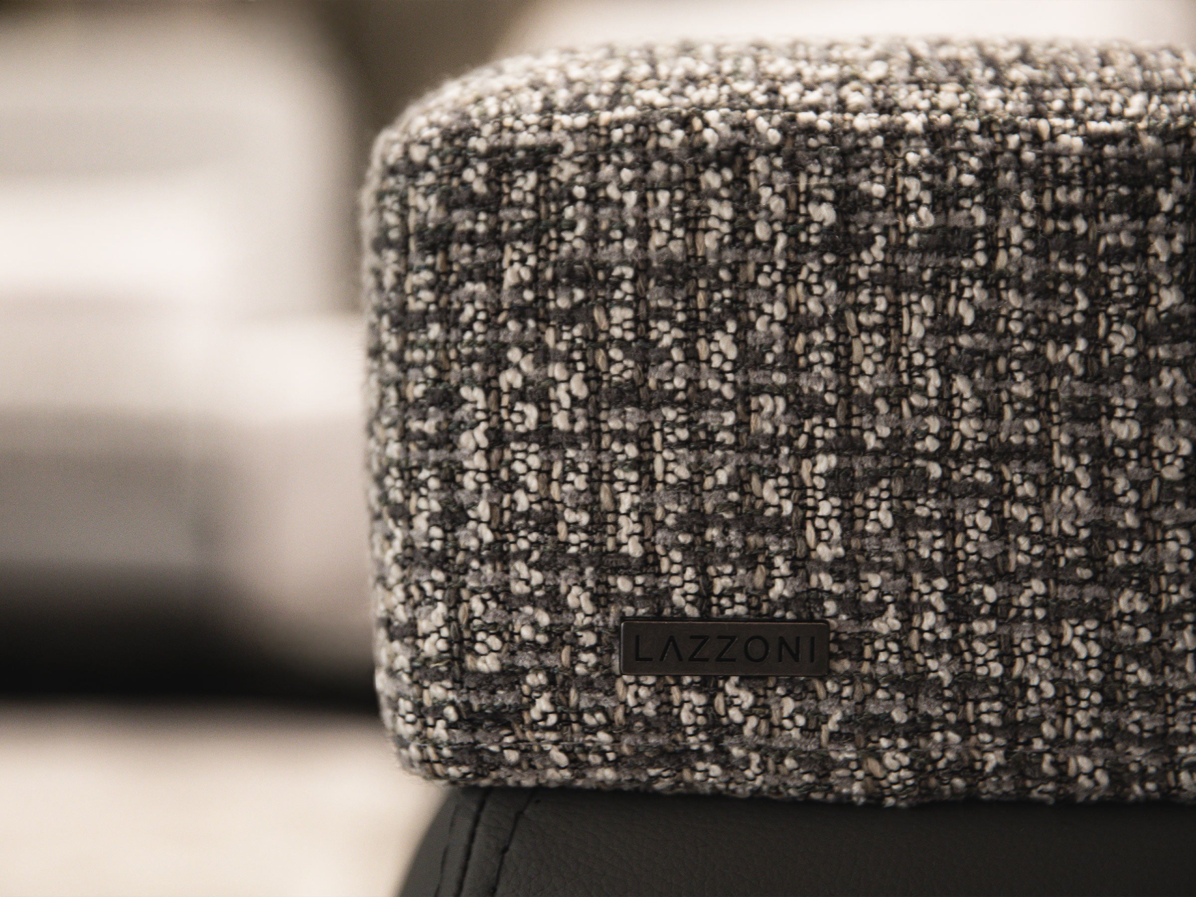 Textured fabric surface with a brand logo in the center