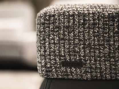 Textured fabric surface with a brand logo in the center