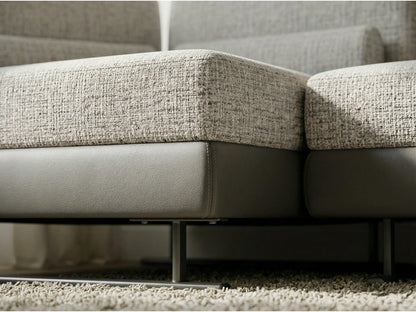 Close-up of a textured beige sofa on a carpeted floor