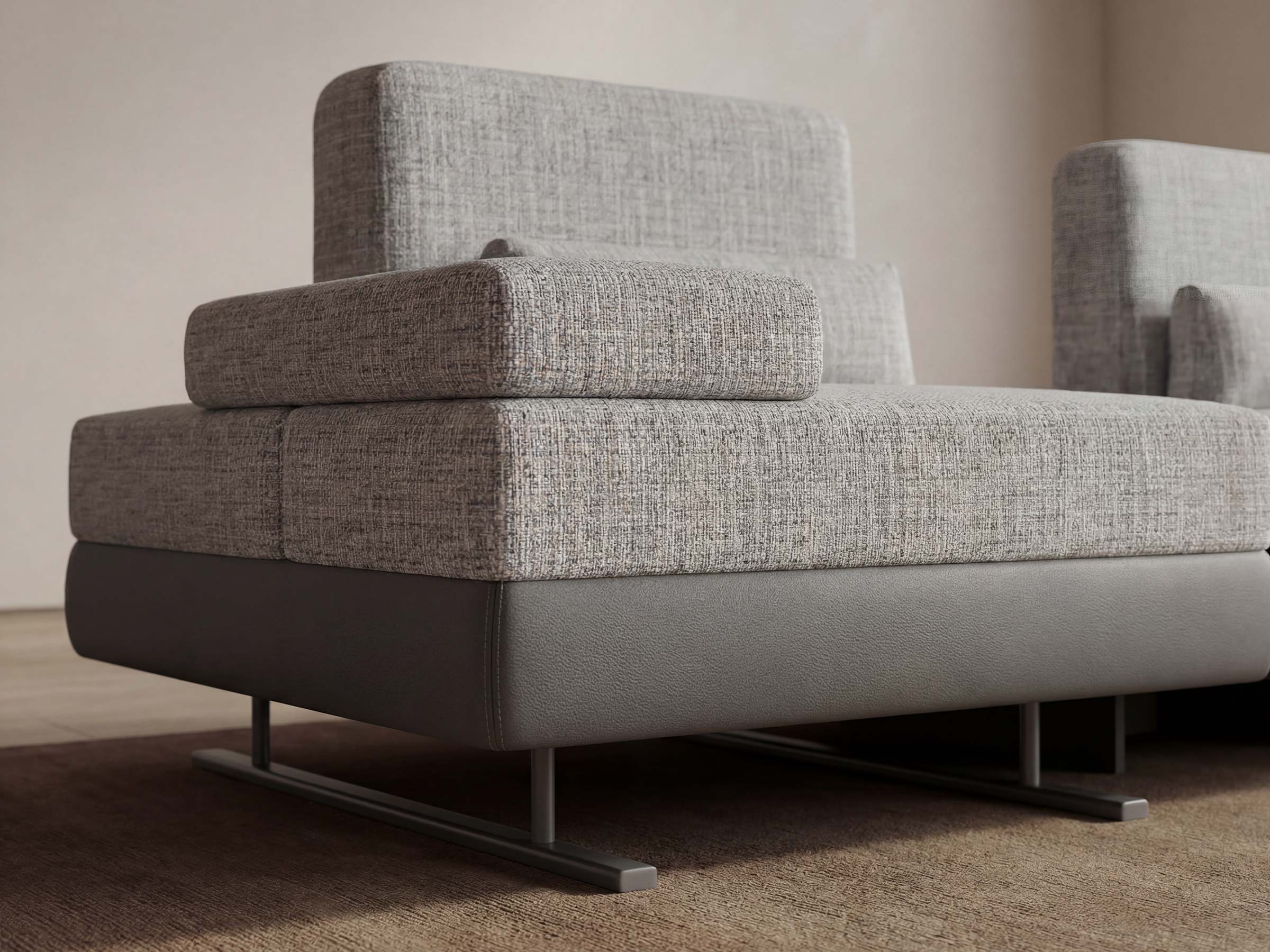 Gray upholstered sofa with a textured fabric finish on a neutral background