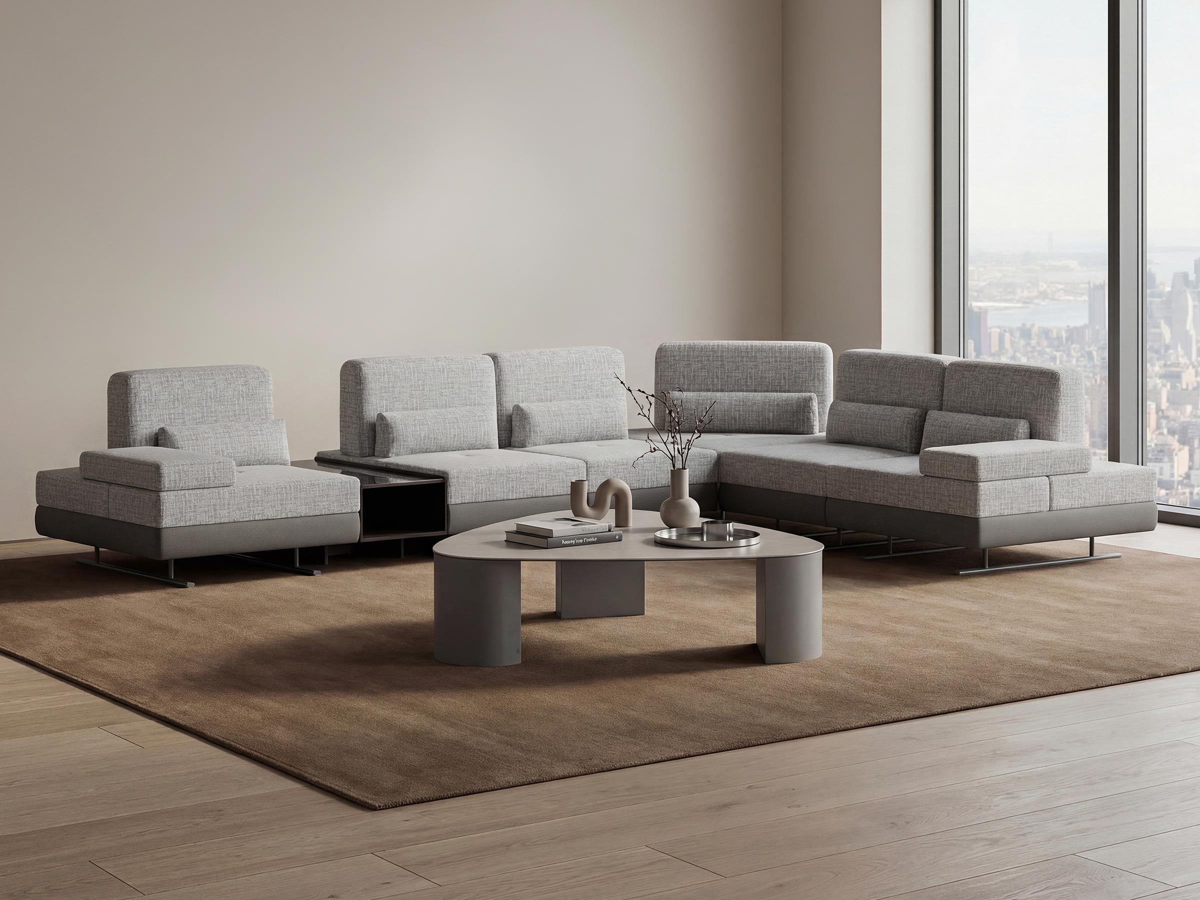 Gray sectional sofa in a modern living room with a coffee table and decor items.