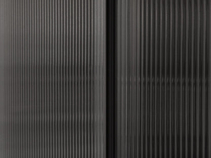Close-up of a textured black surface with vertical lines