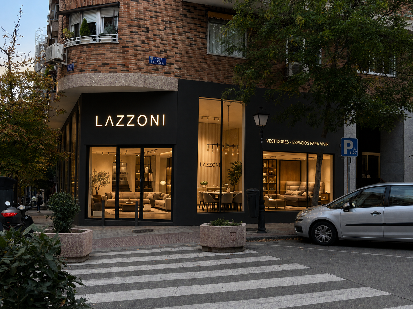 Lazzoni store front with illuminated sign on a city street